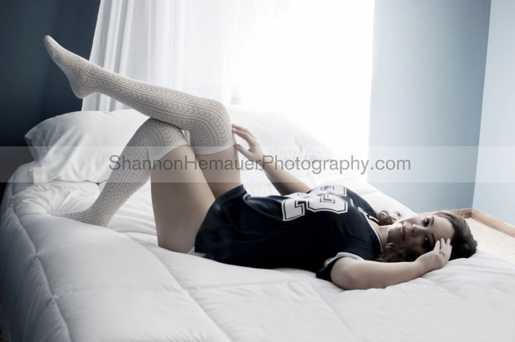 Wearing football jersey for boudoir session Shannon Hemauer Photography