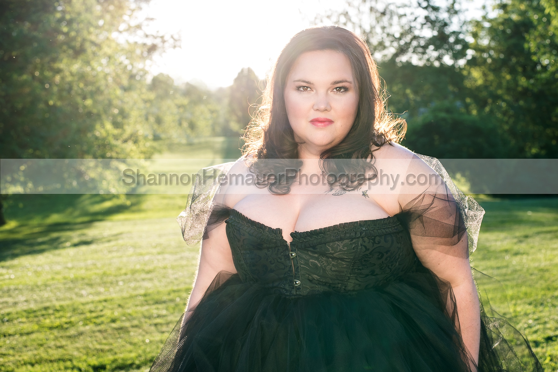 Contemporary glamour session wearing black corset. 